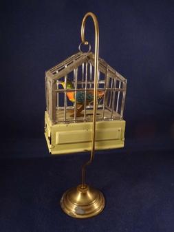 Ancien jouet m&eacute;canique t&ocirc;le oiseau siffleur en cage Techno