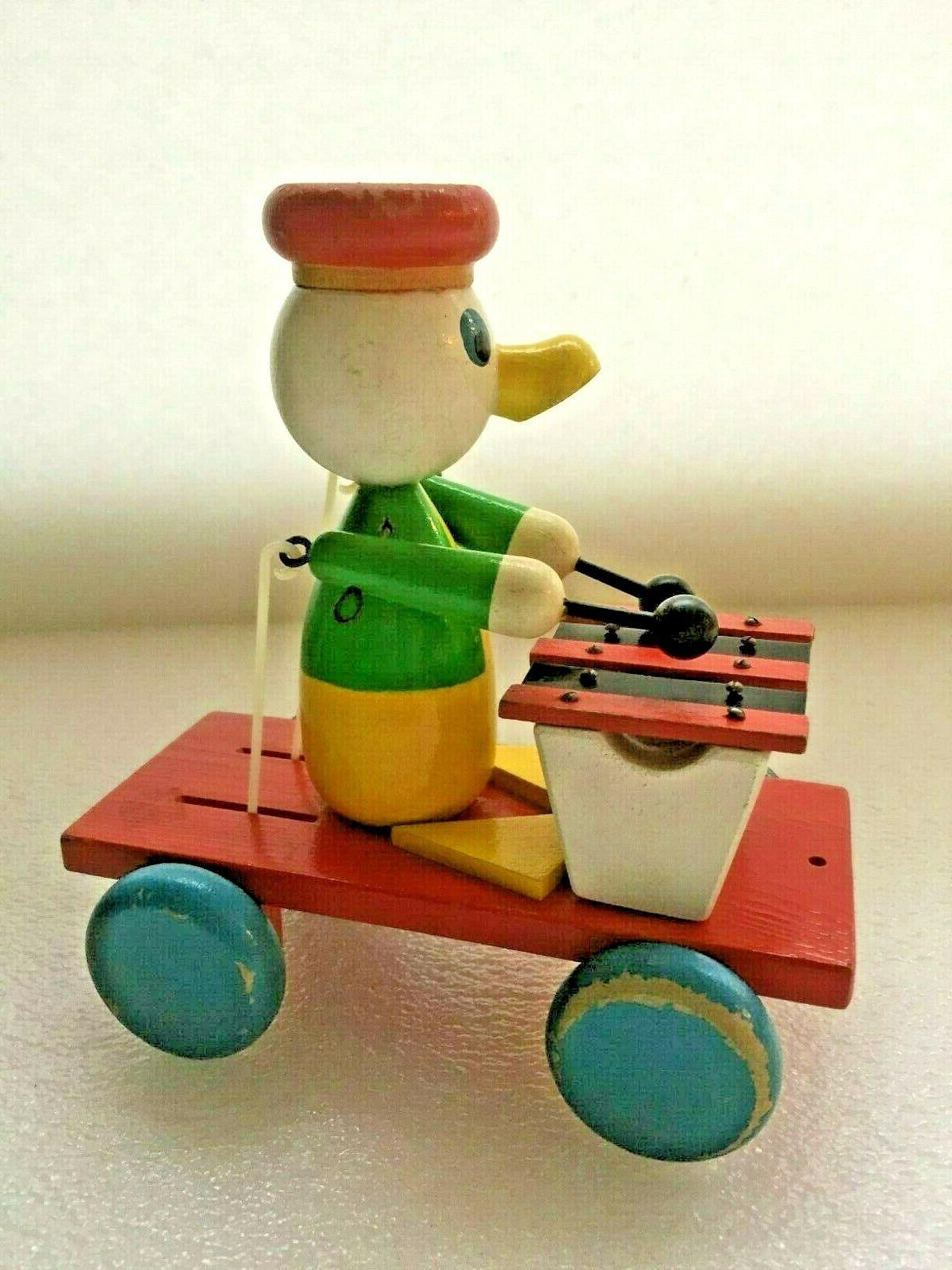 jouet en bois vintage canard jouant du