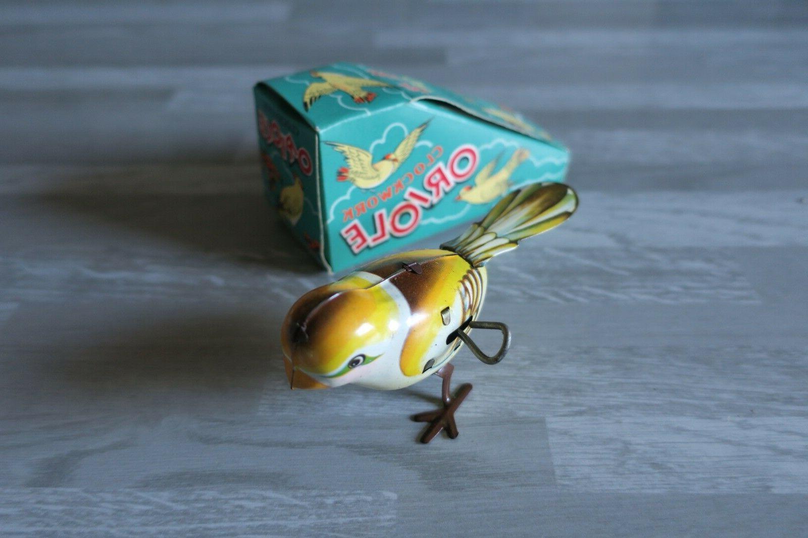 oiseau mecanique oriole clockwork jouet des annees